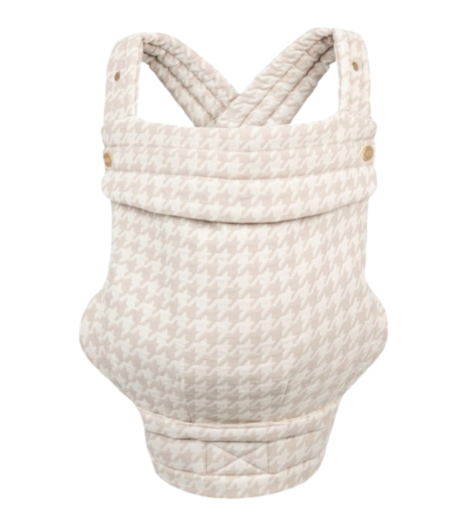 The Mabē Monarch Carrier, front view, alone on a white background. The carrier has crossed straps for across the back and a fold-down head support flap with snaps. This colorway is Houndstooth, which is warm off-white and beige in a medium-scale houndstooth patterning.