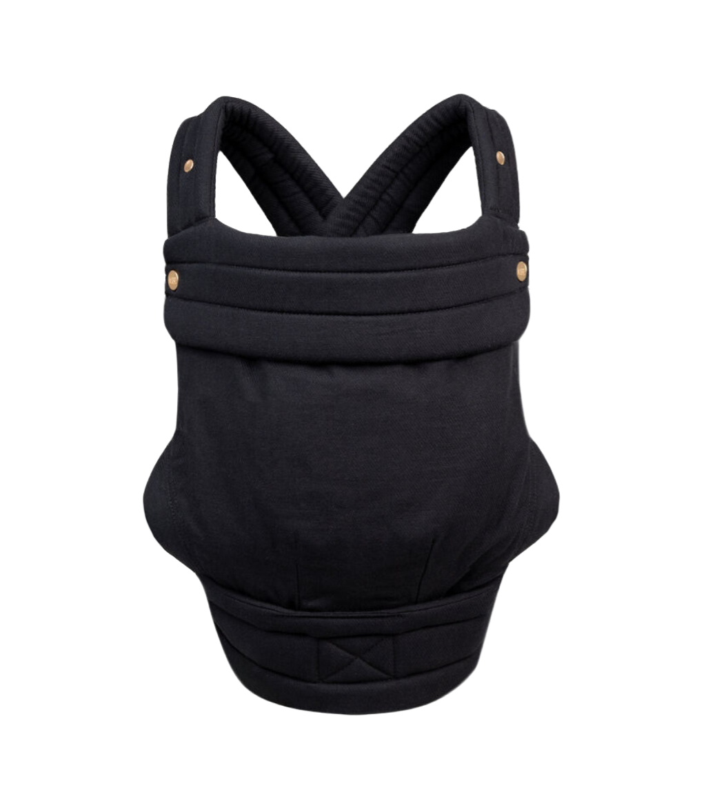 The Mabē Monarch Carrier, front view, alone on a white background. The carrier has crossed straps for across the back and a fold-down head support flap with snaps. This colorway is Ebony, which is solid black.